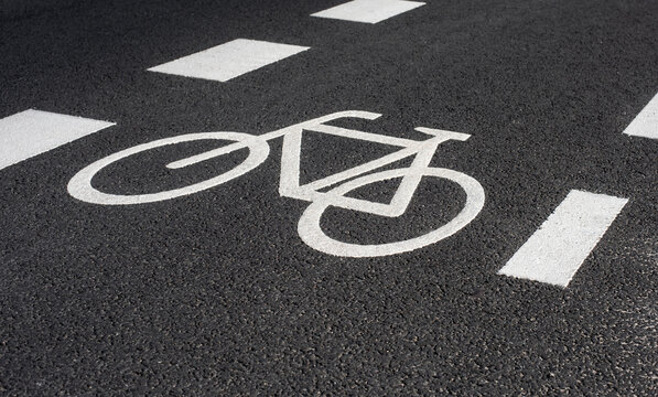 bicycle icon marking a bike lane on a road