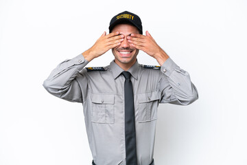 Young safeguard man over isolated white background covering eyes by hands