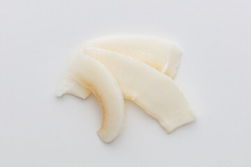 Coconut chips isolated on white background.