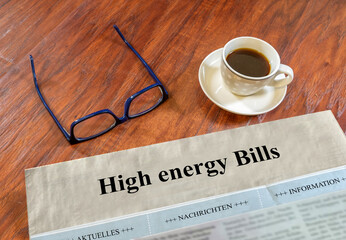 High energy Bills newspaper with glasses and coffee on a desk