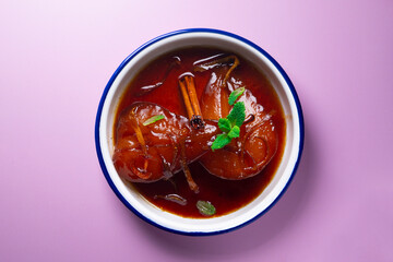 Pears cooked with red wine. Spanish traditional dessert recipe.