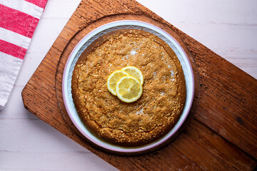 Lemon cake seen from above decorated with a few slices of fruit.
