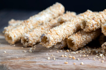 waffle tube with chocolate filling and crushed peanuts