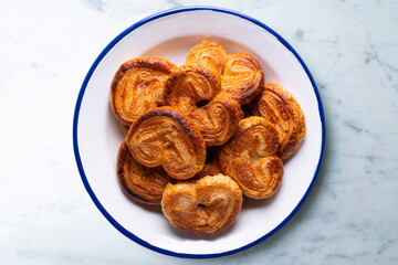 Palmeritas. Puff pastry palm trees with sugar. Spanish traditional dessert.