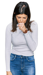 Beautiful brunette woman wearing casual clothes feeling unwell and coughing as symptom for cold or bronchitis. health care concept.