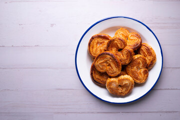Palmeritas. Puff pastry palm trees with sugar. Spanish traditional dessert.