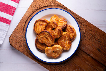 Palmeritas. Puff pastry palm trees with sugar. Spanish traditional dessert.