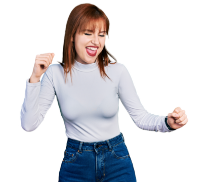 Redhead young woman wearing casual turtleneck sweater dancing happy and cheerful, smiling moving casual and confident listening to music