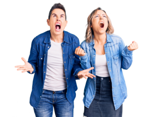 Couple of women wearing casual clothes crazy and mad shouting and yelling with aggressive expression and arms raised. frustration concept.
