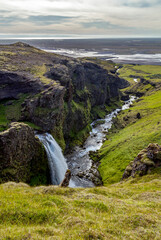 Fototapeta na wymiar an unknown little waterfall next to the famous Seljalandsfoss waterfall, Iceland