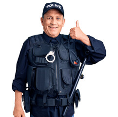 Senior handsome man wearing police uniform smiling happy and positive, thumb up doing excellent and approval sign