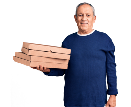 Senior handsome man holding pizza boxes looking positive and happy standing and smiling with a confident smile showing teeth - Powered by Adobe