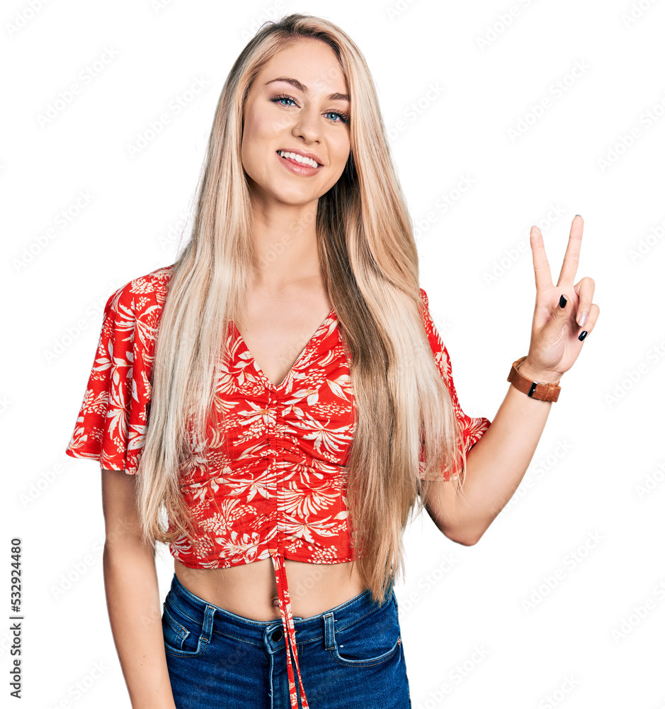 Poster Beautiful young blonde woman wearing summer shirt smiling looking to the camera showing fingers doing victory sign. number two.