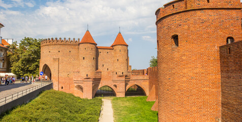 Historic red brick city gate in the center of Warsaw, Poland - obrazy, fototapety, plakaty