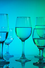 Wine glasses with neon multicolor light
