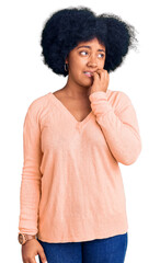 Fototapeta na wymiar Young african american girl wearing casual clothes looking stressed and nervous with hands on mouth biting nails. anxiety problem.