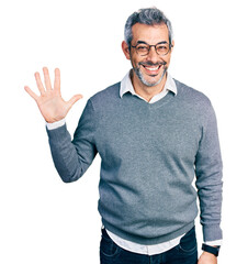 Middle age hispanic with grey hair wearing glasses showing and pointing up with fingers number five...