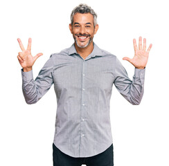 Naklejka premium Middle age grey-haired man wearing casual clothes showing and pointing up with fingers number eight while smiling confident and happy.
