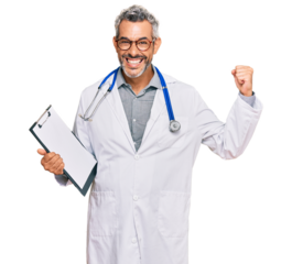 Middle age grey-haired man wearing doctor stethoscope holding clipboard screaming proud, celebrating victory and success very excited with raised arms
