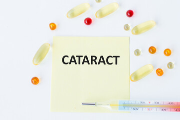 CATARACT inscription on a yellow card on a white background rows and a thermometer