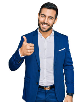 Young hispanic man wearing business jacket doing happy thumbs up gesture with hand. approving expression looking at the camera showing success.