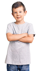 Cute blond kid wearing casual clothes happy face smiling with crossed arms looking at the camera....