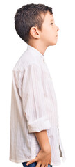 Cute blond kid wearing elegant shirt looking to side, relax profile pose with natural face and confident smile.