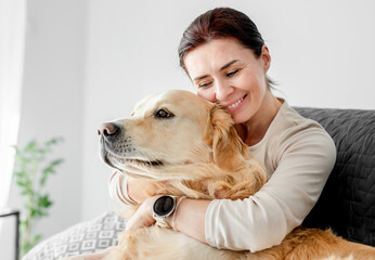 Girl with golden retriever dog