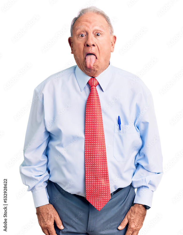 Canvas Prints senior handsome grey-haired man wearing elegant tie and shirt sticking tongue out happy with funny e