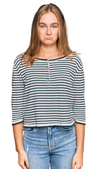 Fototapeta premium Beautiful blonde woman wearing casual clothes depressed and worry for distress, crying angry and afraid. sad expression.