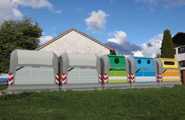 Five bins for separate waste collection where you can throw away plastic glass paper and other...
