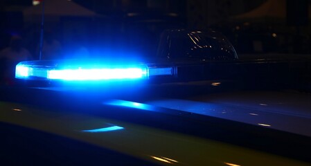 blue flashing of police car siren during emergency