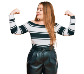 Young beautiful redhead woman wearing elegant clothes showing arms muscles smiling proud. fitness concept.