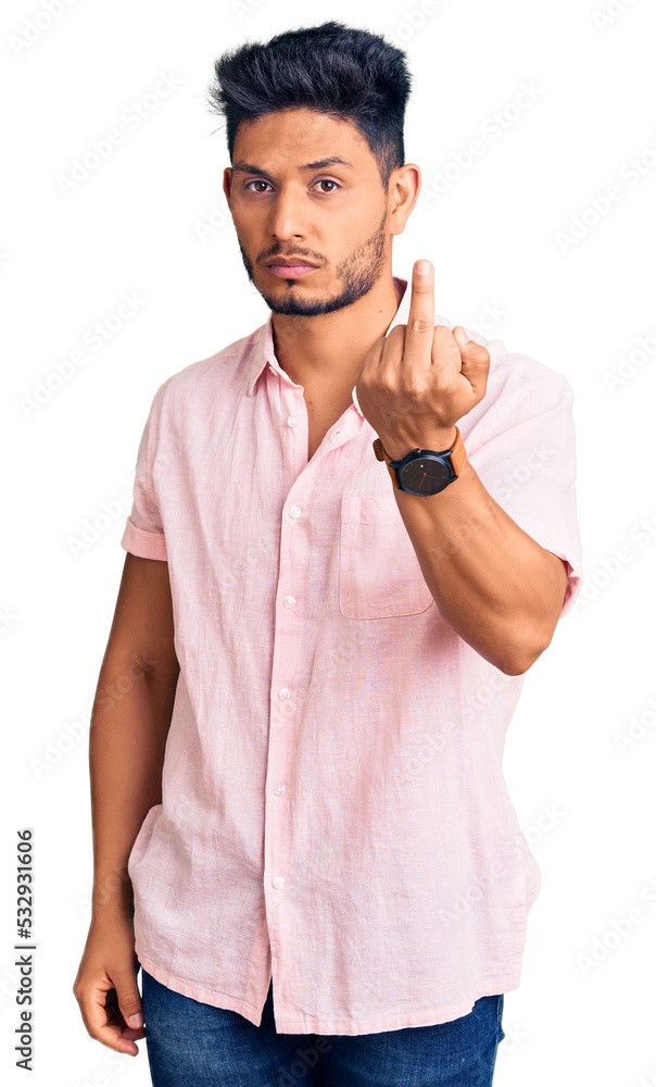 Wall mural Handsome latin american young man wearing casual summer shirt showing middle finger, impolite and rude fuck off expression