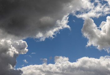 Naklejka na ściany i meble Blue sky with light clouds in windy weather