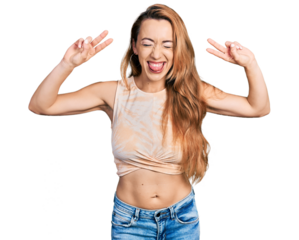 Young caucasian woman doing victory sign and peace gesture sticking tongue out happy with funny expression.