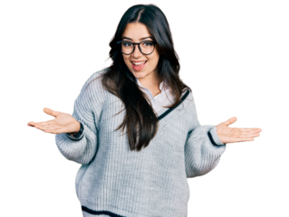 Beautiful hispanic woman wearing casual sweater and glasses smiling showing both hands open palms, presenting and advertising comparison and balance