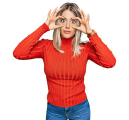 Beautiful blonde woman wearing casual clothes trying to open eyes with fingers, sleepy and tired...