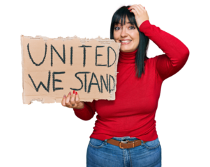 Young hispanic woman holding united we stand banner stressed and frustrated with hand on head, surprised and angry face