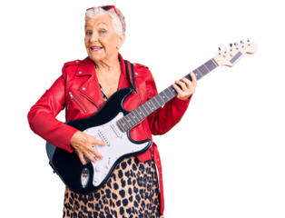 Senior beautiful woman with blue eyes and grey hair wearing a modern look playing electric guitar winking looking at the camera with sexy expression, cheerful and happy face.