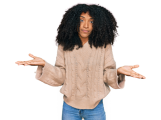 Young african american girl wearing casual clothes clueless and confused expression with arms and hands raised. doubt concept.