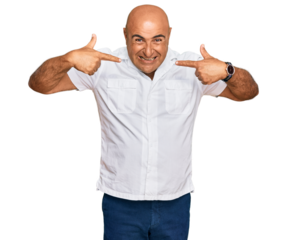 Mature middle east man with mustache wearing casual white shirt smiling cheerful showing and pointing with fingers teeth and mouth. dental health concept.