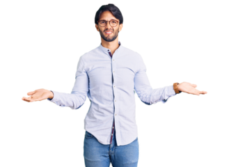 Handsome hispanic man wearing business shirt and glasses clueless and confused with open arms, no idea concept.