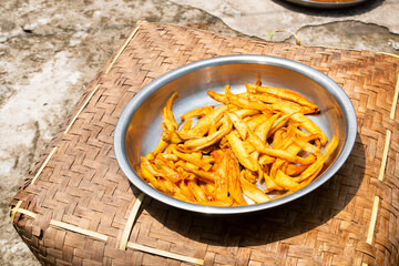 mango slices under the sun to dry it for making mango powder or pickle. Natural food preservation.