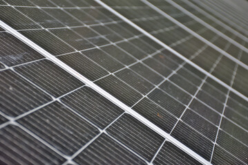 Installation of photovoltaic panels. Macro photography and perspective of the panels and cells. Self-consumption concept.