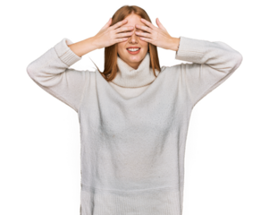 Young irish woman wearing casual winter sweater covering eyes with hands smiling cheerful and funny. blind concept.