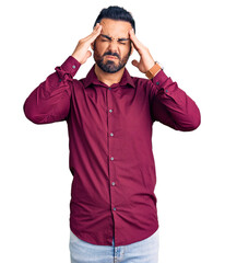 Young hispanic man wearing casual clothes suffering from headache desperate and stressed because pain and migraine. hands on head.