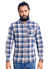 Fototapeta premium Young arab man wearing casual clothes depressed and worry for distress, crying angry and afraid. sad expression.