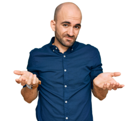 Young hispanic man wearing casual clothes clueless and confused with open arms, no idea concept.