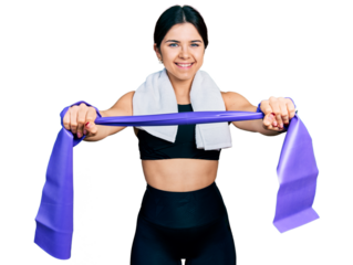 Young brunette woman with blue eyes training arm resistance with elastic arm bands smiling with a happy and cool smile on face. showing teeth.